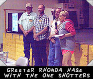 Greeter Rhonda Hase introducing the One Shotters Team