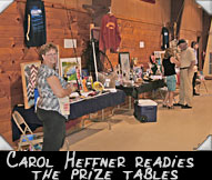 Carol Heffner readies the prize tables