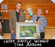 Lucky Raffle winner Tina Ahrens shown here with noted wildlife artist Rodd Umlauf